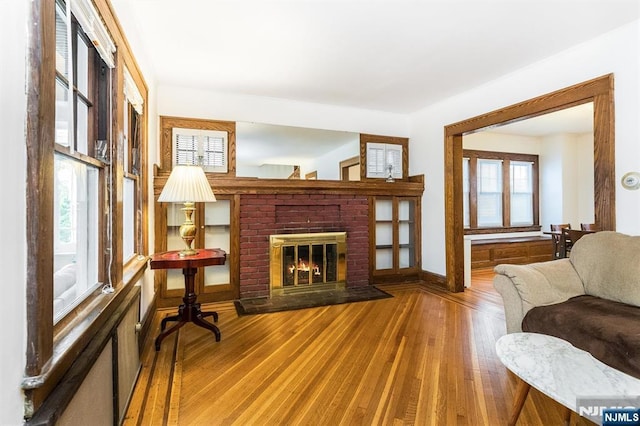 39 Lexington Ave, Bloomfield, NJ 07003 - living area featuring wood finished floors and a brick fireplace