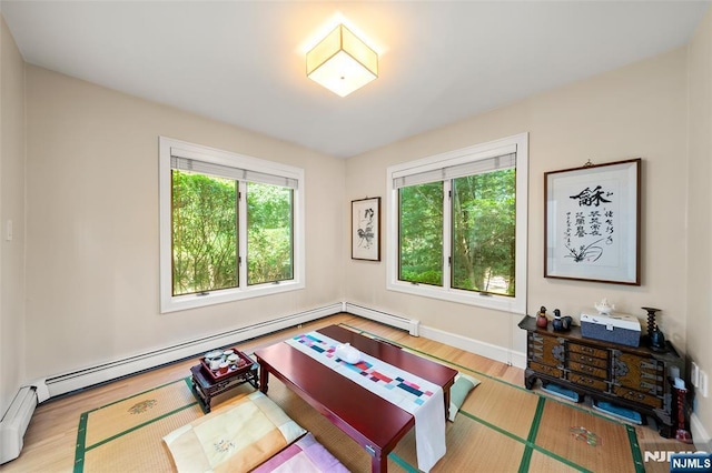 811 Domm Ct, Wyckoff, NJ 07481 - living room featuring baseboard heating and wood finished floors