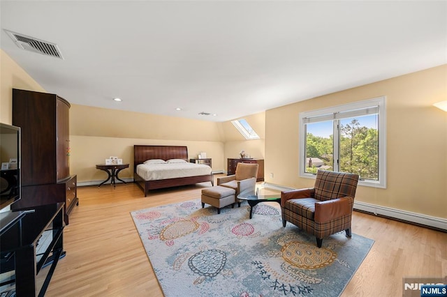 811 Domm Ct, Wyckoff, NJ 07481 - bedroom with light wood-type flooring, a skylight, and baseboard heating