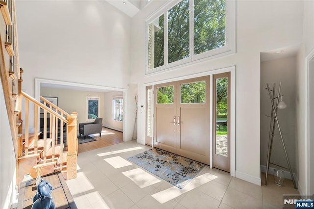 811 Domm Ct, Wyckoff, NJ 07481 - entryway featuring a towering ceiling, stairway, and tile patterned flooring