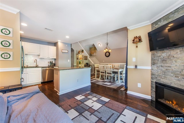 434 Cambridge Dr, Butler Borough, NJ 07405 - kitchen with dishwasher, dark wood finished floors, white cabinetry, decorative backsplash, and a center island