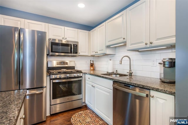 434 Cambridge Dr, Butler Borough, NJ 07405 - kitchen with stainless steel appliances, white cabinetry, decorative backsplash, dark stone countertops, and recessed lighting