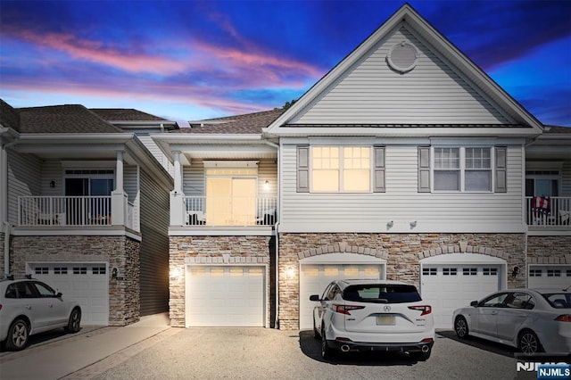 6 Elston Ct, Wanaque, NJ 07420 - multi unit property featuring a garage, driveway, and stone siding