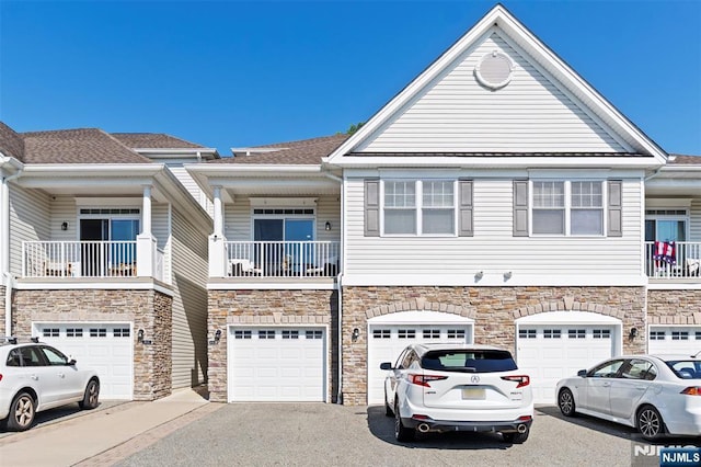6 Elston Ct, Wanaque, NJ 07420 - multi unit property featuring driveway, stone siding, and a garage