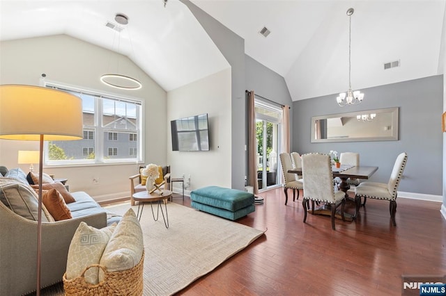 6 Elston Ct, Wanaque, NJ 07420 - living area featuring vaulted ceiling, a chandelier, and wood finished floors