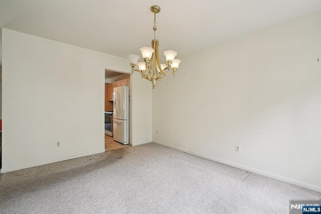 71 Butternut Dr Unit 71, Wayne, NJ 07470 - unfurnished room featuring light carpet and a chandelier