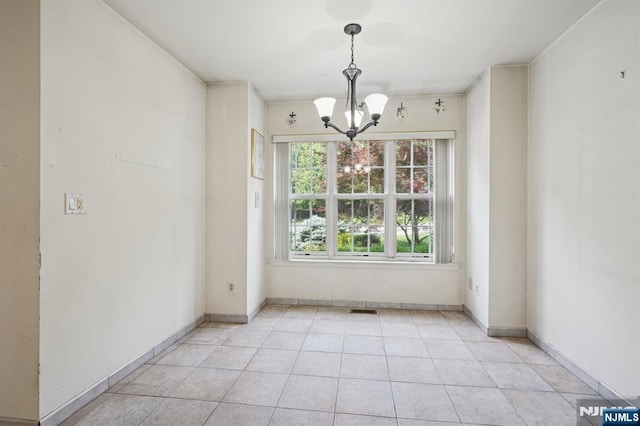 71 Butternut Dr Unit 71, Wayne, NJ 07470 - unfurnished dining area featuring a chandelier and light tile patterned floors