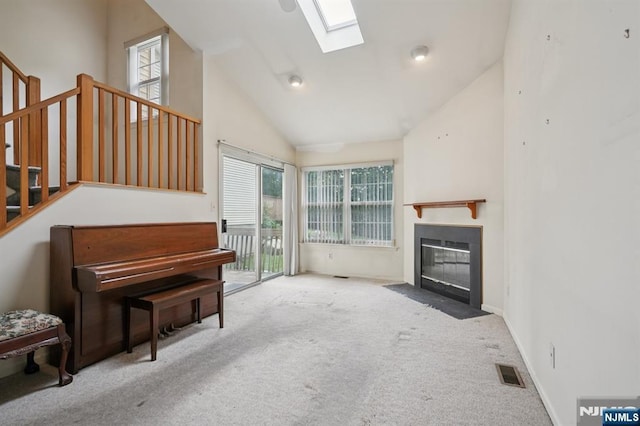 71 Butternut Dr Unit 71, Wayne, NJ 07470 - living room featuring a skylight, carpet floors, stairway, plenty of natural light, and vaulted ceiling