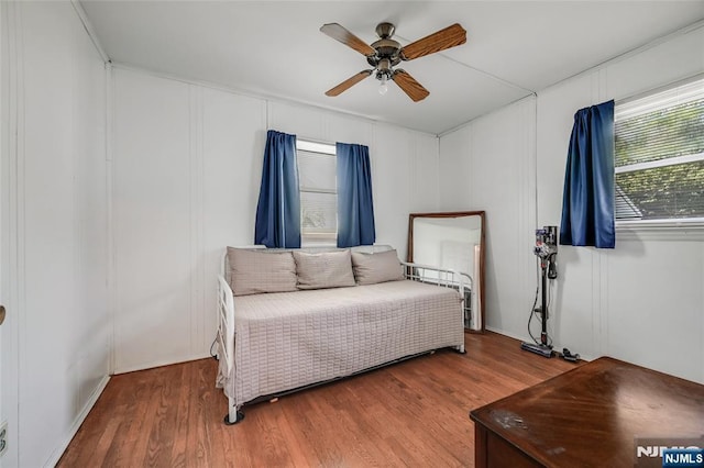 23 Bromley Pl, Bloomfield, NJ 07003 - bedroom featuring wood finished floors, a ceiling fan, and a decorative wall