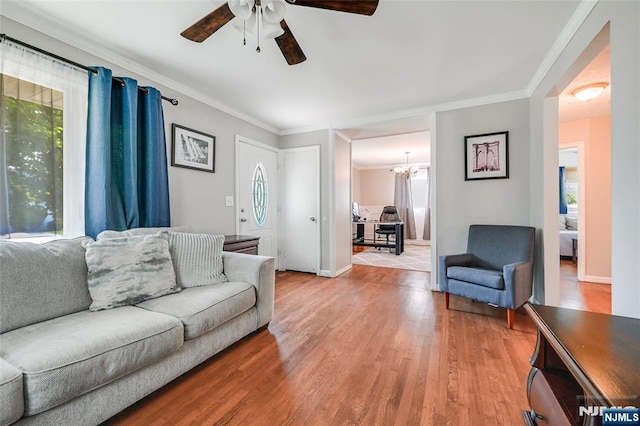 23 Bromley Pl, Bloomfield, NJ 07003 - living room featuring a ceiling fan, light wood-style floors, ornamental molding, and a chandelier