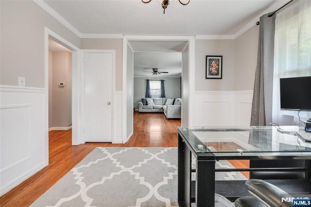 23 Bromley Pl, Bloomfield, NJ 07003 - office space with wood finished floors, a wainscoted wall, ornamental molding, and a ceiling fan
