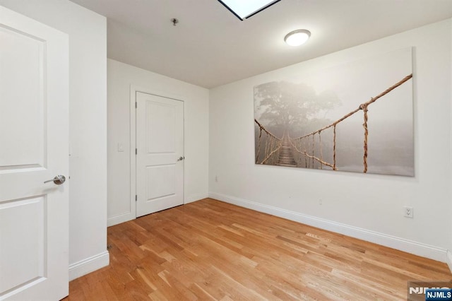 5711 Jefferson St Unit 405, West New York, NJ 07093 - empty room featuring wood finished floors and fire sprinkler in ceiling
