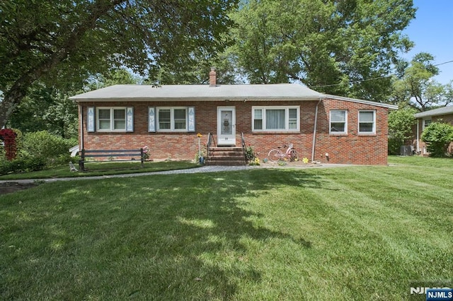 28 Stylon Rd, Wayne, NJ 07470 - single story home with a front yard, brick siding, a chimney, and entry steps