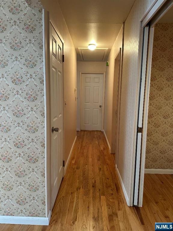 28 Stylon Rd, Wayne, NJ 07470 - hallway with light wood finished floors and wallpapered walls