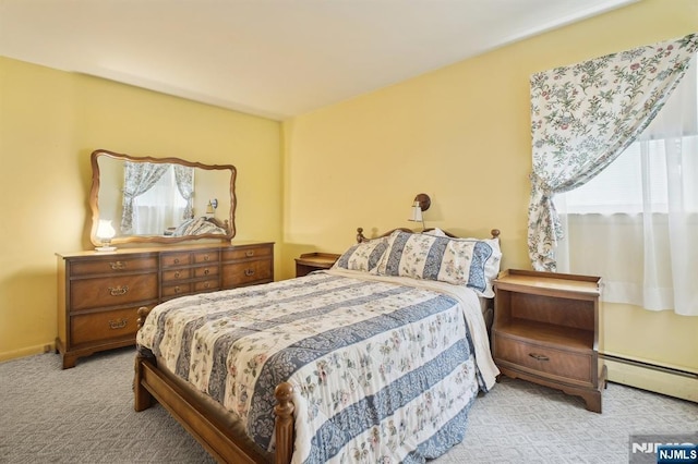 28 Stylon Rd, Wayne, NJ 07470 - bedroom featuring a baseboard heating unit and carpet flooring