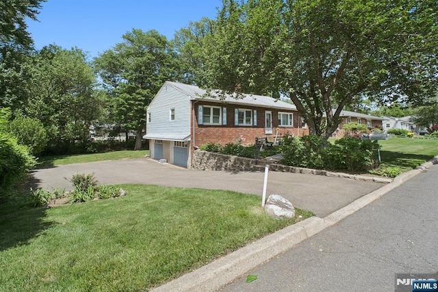 28 Stylon Rd, Wayne, NJ 07470 - single story home with an attached garage, brick siding, driveway, and a front lawn