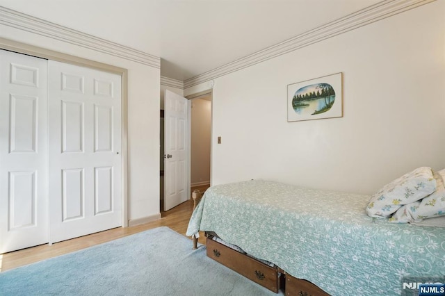 28 Stylon Rd, Wayne, NJ 07470 - bedroom featuring wood finished floors, a closet, and crown molding
