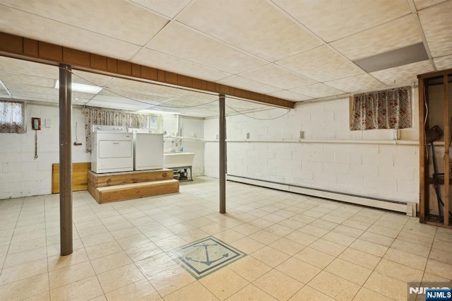 28 Stylon Rd, Wayne, NJ 07470 - below grade area with a drop ceiling, a baseboard heating unit, and washer and clothes dryer