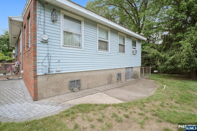 28 Stylon Rd, Wayne, NJ 07470 - view of side of home with a yard, a patio, and cooling unit