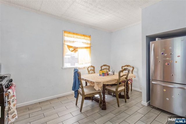 320 Clifton Ave, Newark, NJ 07104 - dining area with ornamental molding and wood tiled floors