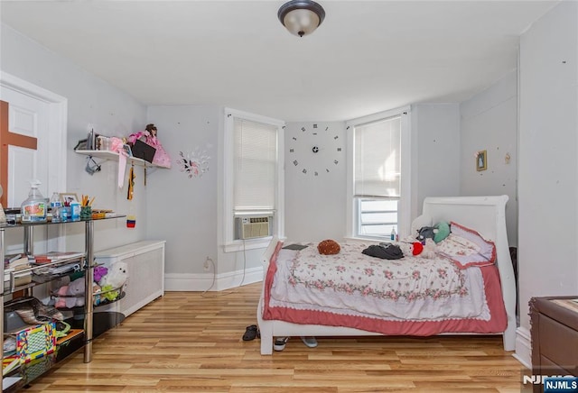 320 Clifton Ave, Newark, NJ 07104 - bedroom with cooling unit and light wood-style floors