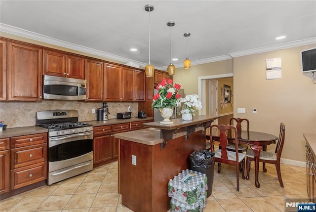 320 Clifton Ave, Newark, NJ 07104 - kitchen featuring stainless steel appliances, light tile patterned floors, crown molding, decorative backsplash, and decorative light fixtures