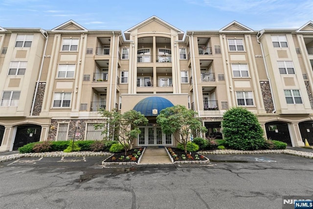 7303 Ravenscroft Rd Unit 570, Clifton, NJ 07013 - view of building exterior featuring uncovered parking