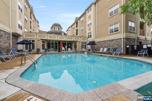 7303 Ravenscroft Rd Unit 570, Clifton, NJ 07013 - community pool featuring a patio area