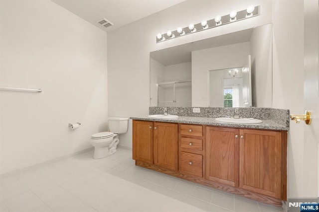 7303 Ravenscroft Rd Unit 570, Clifton, NJ 07013 - bathroom featuring double vanity, an enclosed shower, and tile patterned floors