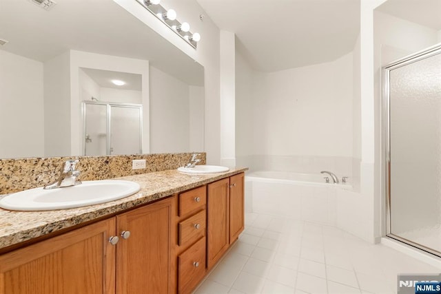 7303 Ravenscroft Rd Unit 570, Clifton, NJ 07013 - full bath with a stall shower, tile patterned flooring, a bath, and double vanity