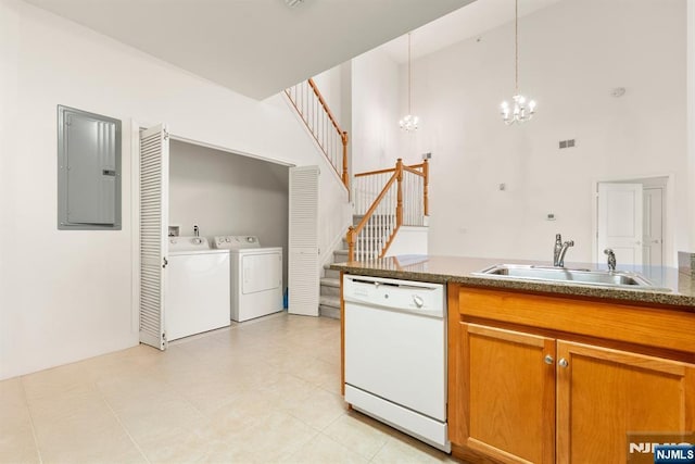 7303 Ravenscroft Rd Unit 570, Clifton, NJ 07013 - kitchen with white dishwasher, a towering ceiling, electric panel, a chandelier, and brown cabinetry