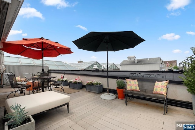 187 Wayne St Unit 405, Jersey City, NJ 07302 - wooden terrace featuring outdoor dining area