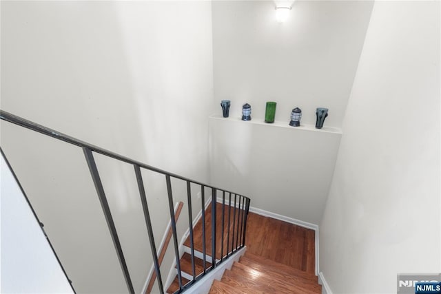 187 Wayne St Unit 405, Jersey City, NJ 07302 - stairway with wood finished floors and baseboards