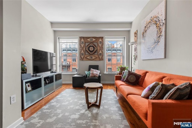187 Wayne St Unit 405, Jersey City, NJ 07302 - living area featuring wood finished floors and baseboards