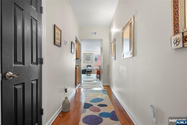 187 Wayne St Unit 405, Jersey City, NJ 07302 - corridor with wood finished floors and baseboards