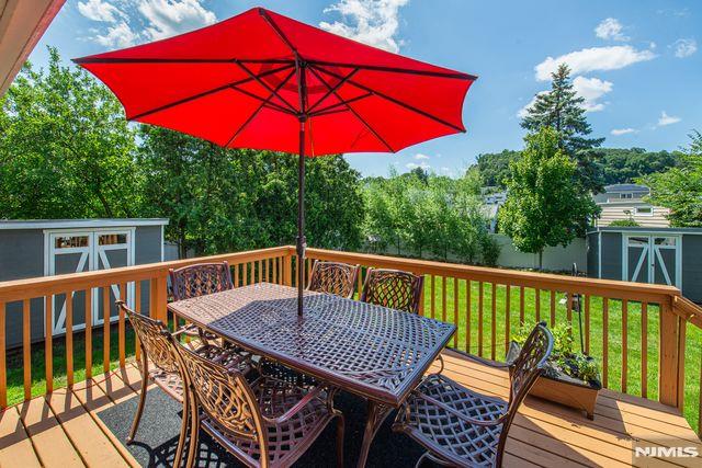 20 Goss Pl, Clifton, NJ 07013 - deck featuring a shed, outdoor dining space, and a lawn