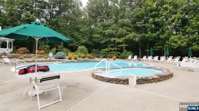 2214 Richmond Unit 2214, West Milford, NJ 07480 - community pool with a patio and view of wooded area