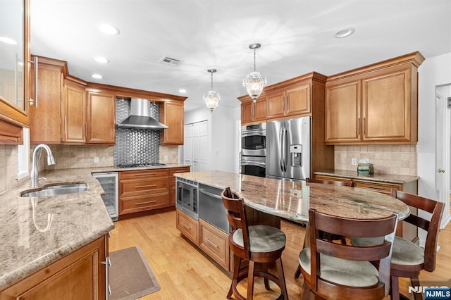 506 Salem St, Paramus, NJ 07652 - kitchen with appliances with stainless steel finishes, beverage cooler, wall chimney exhaust hood, backsplash, and light wood-style floors