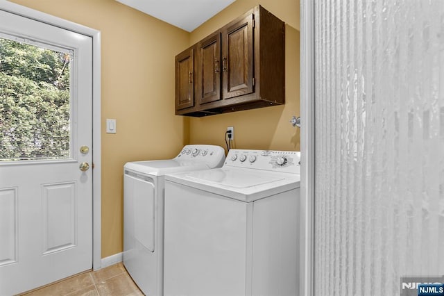 506 Salem St, Paramus, NJ 07652 - laundry area featuring independent washer and dryer, cabinet space, and light tile patterned floors