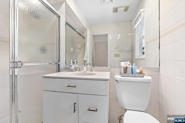506 Salem St, Paramus, NJ 07652 - bathroom featuring tile walls, vanity, and a shower stall