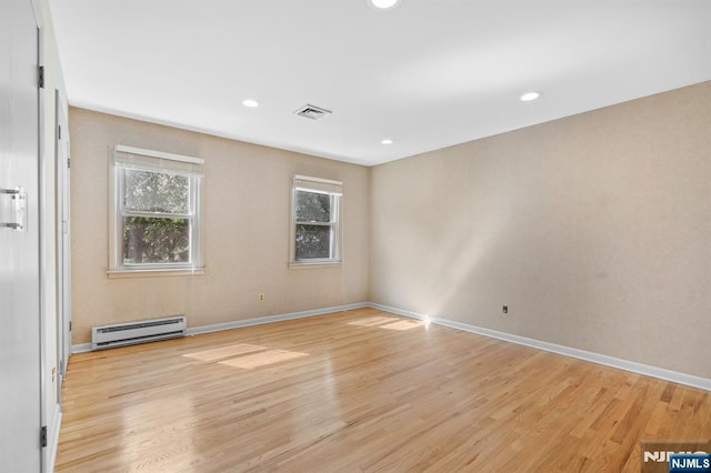 506 Salem St, Paramus, NJ 07652 - spare room featuring a baseboard radiator, light wood-type flooring, and recessed lighting
