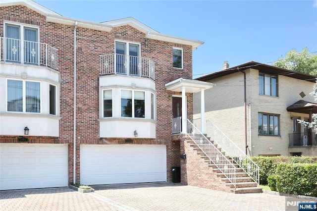 400 Lawton Ave Unit C0400, Cliffside Park, NJ 07010 - view of front of house featuring decorative driveway, a garage, and brick siding