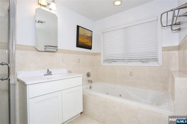 400 Lawton Ave Unit C0400, Cliffside Park, NJ 07010 - full bathroom featuring a whirlpool tub, vanity, and wainscoting