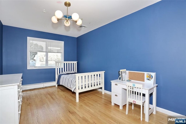 400 Lawton Ave Unit C0400, Cliffside Park, NJ 07010 - bedroom with a chandelier, light wood finished floors, and a baseboard radiator