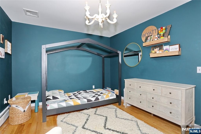 400 Lawton Ave Unit C0400, Cliffside Park, NJ 07010 - bedroom featuring wood finished floors and a chandelier