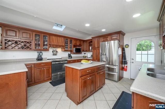 20 Card St, Hamburg, NJ 07419 - kitchen with stainless steel appliances, light tile patterned flooring, glass insert cabinets, recessed lighting, and light countertops