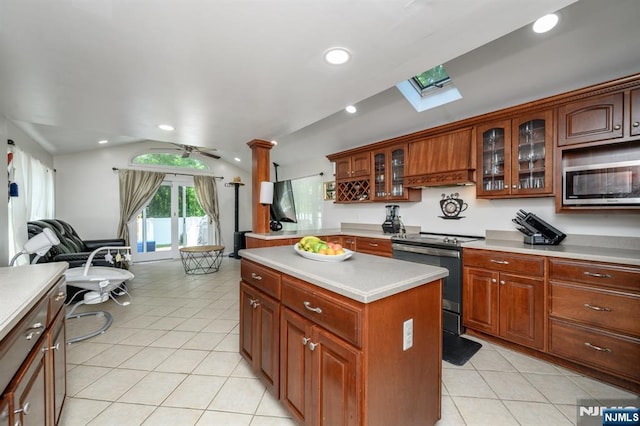 20 Card St, Hamburg, NJ 07419 - kitchen with electric stove, light tile patterned floors, light countertops, a skylight, and vaulted ceiling