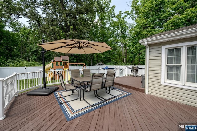 20 Card St, Hamburg, NJ 07419 - deck with outdoor dining space, a playground, and view of wooded area