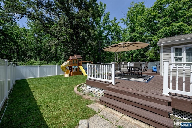 20 Card St, Hamburg, NJ 07419 - fenced backyard featuring a deck, outdoor dining area, and a playground