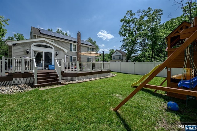 20 Card St, Hamburg, NJ 07419 - fenced backyard with a playground and a wooden deck
